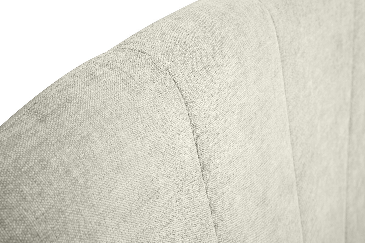 Detalle del cabecero en tejido beige con efecto terciopelo texturizado, vista en 3/4