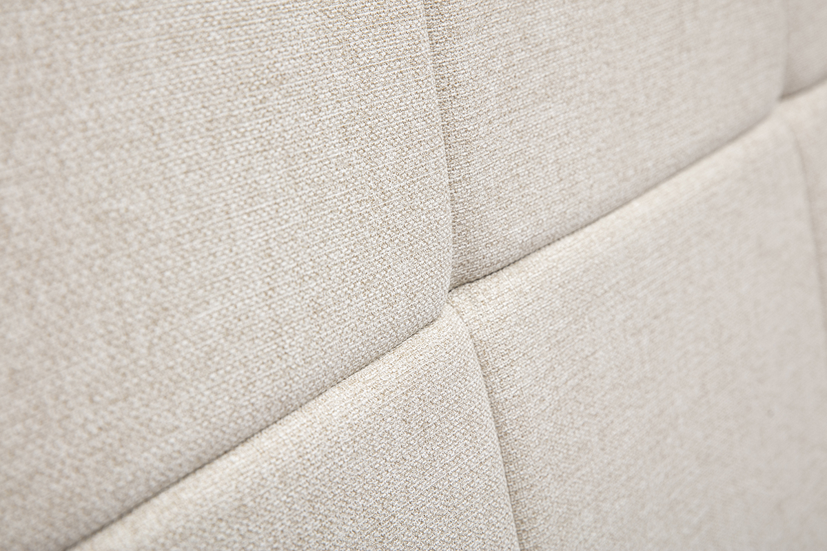 Primer plano de la tela beige crema capiton� del cabecero CLOVIS.