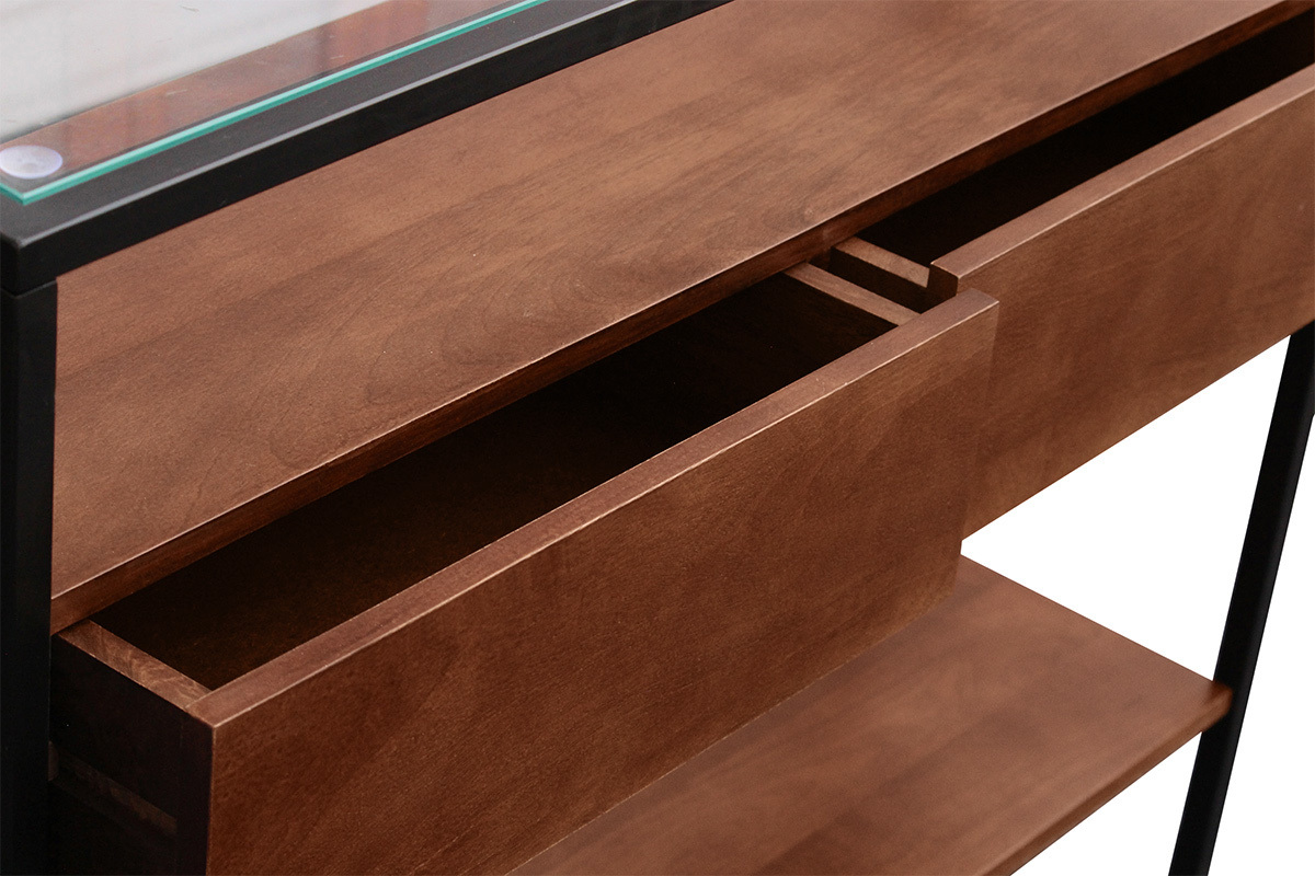 Vista superior de la consola SITA en madera oscura, con dos cajones abiertos y una tapa de vidrio.