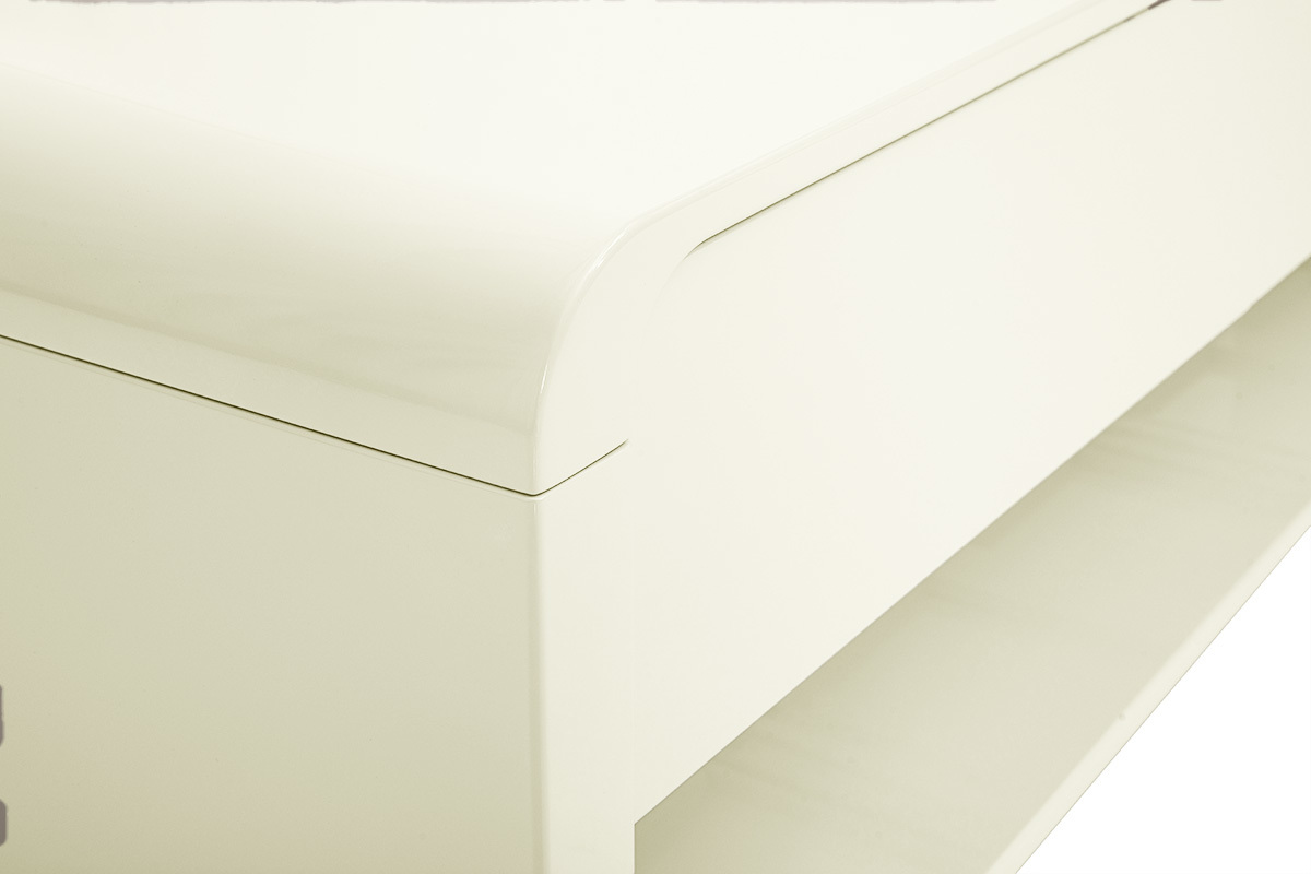 Esquina redondeada de un mueble de TV beige brillante con caj�n visible.