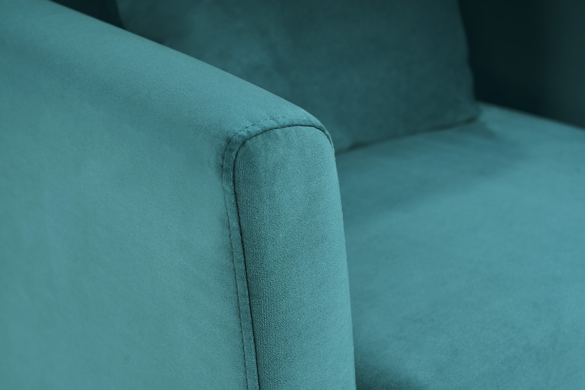 Detalle de la tela de terciopelo azul petr�leo de un sill�n, vista cercana.