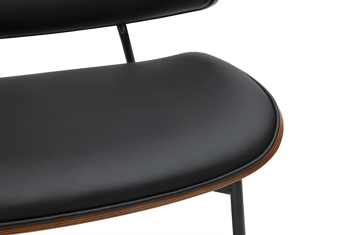 Primer plano del asiento y respaldo de una silla negra FABULO de madera oscura y metal.