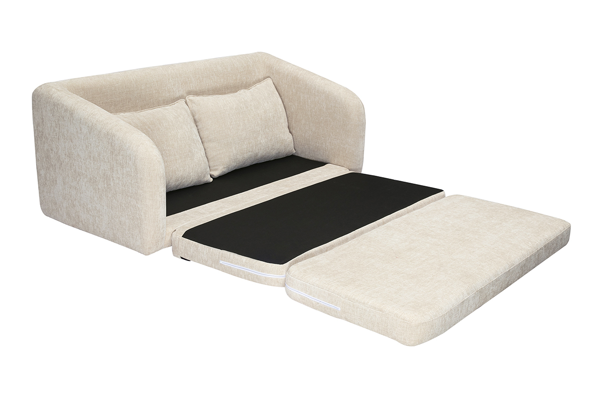 Sof convertible beige efecto terciopelo, abierto en cama.