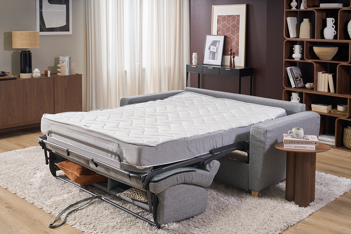 Sof� cama GRAHAM gris claro con el colch�n abierto, en vista de 3/4.