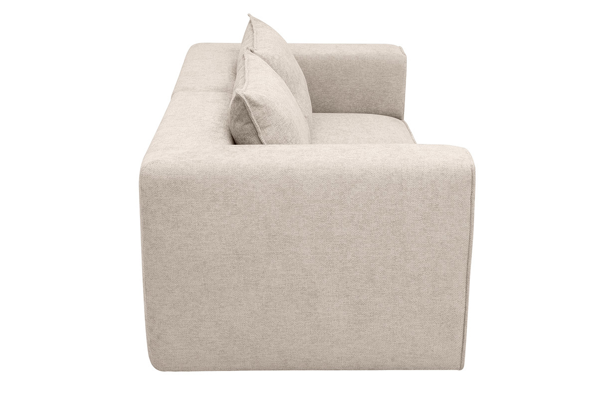 Sof� modular de 2 plazas beige visto de perfil con cojines mullidos.