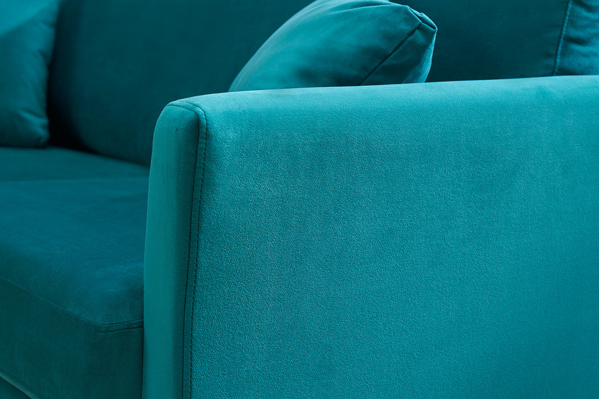 Brazo de sof� de terciopelo azul petr�leo con coj�n.